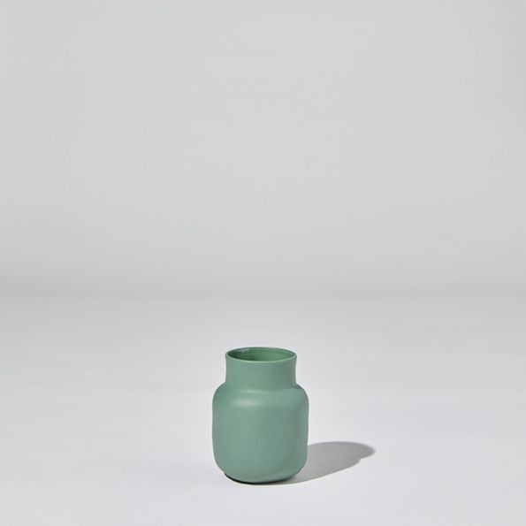 Green vase on a white background
