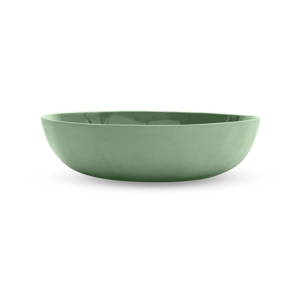 Green ceramic bowl on a white background
