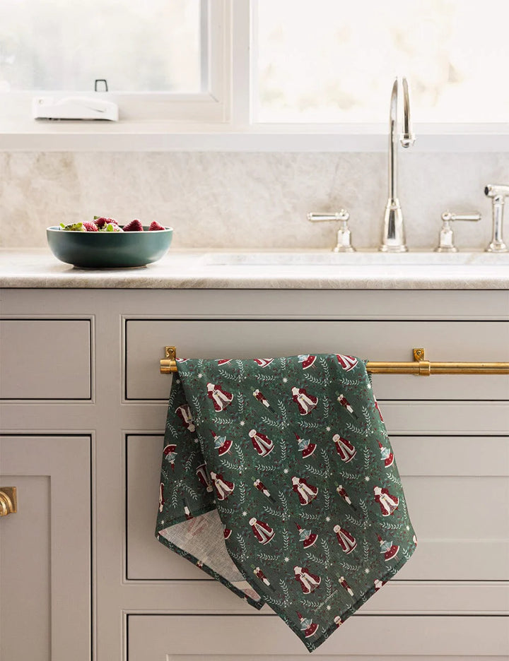 Christmas linen tea towel with santa claus over kitchen drawer handle