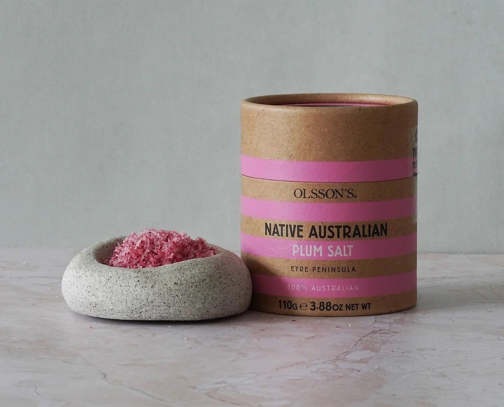 Ollsson's Native Australian Plum Salt container with pink salt in a stone bowl on a light gray background