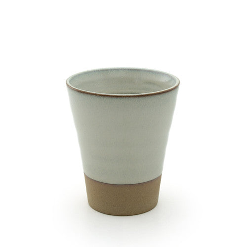 Ceramic cup with a two-tone design on a white background
