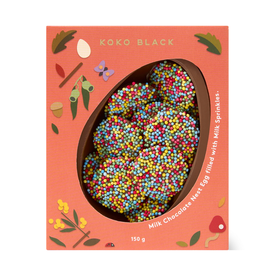 Koko Black milk chocolate nest filled with sprinkles on a white background