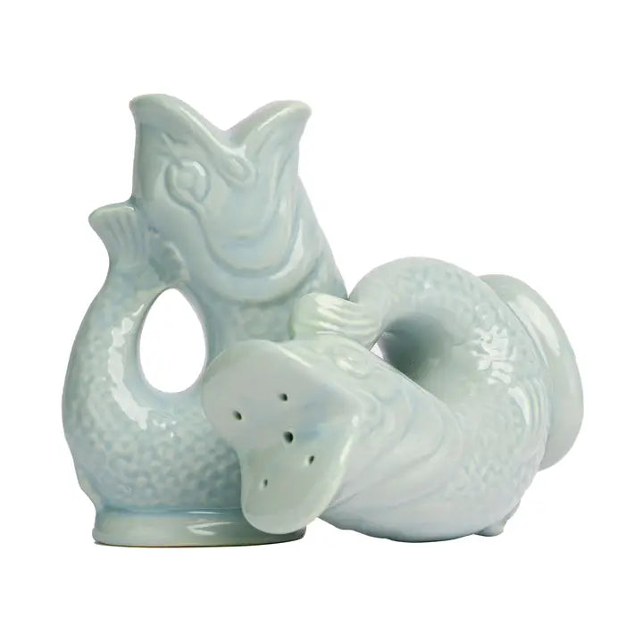 Ceramic salt and pepper shaker set shaped like a fish on a white background