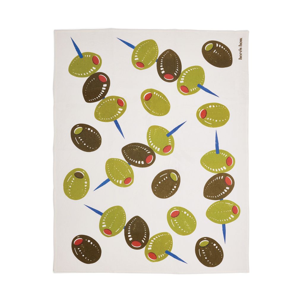 Tea towel with olive pattern on a white background