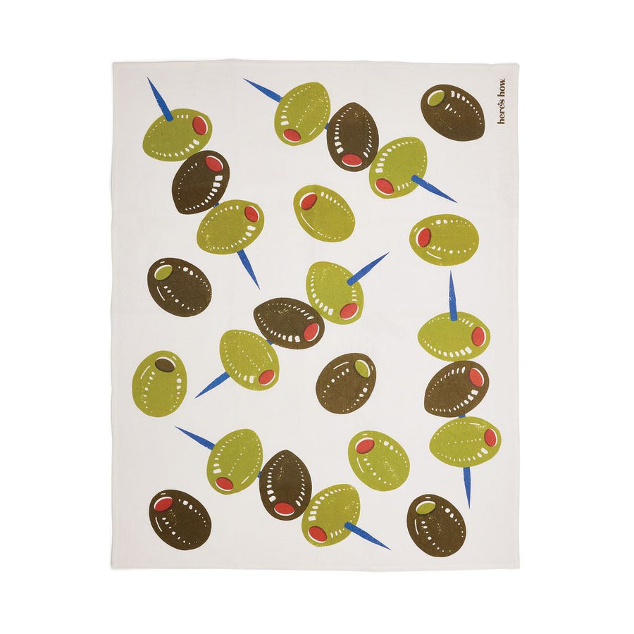 Tea towel with olive pattern on a white background