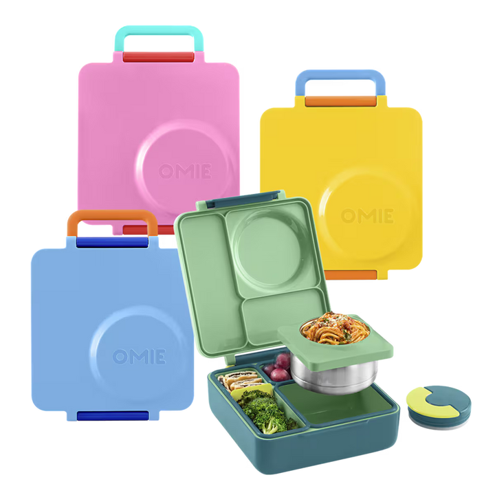 Set of colorful OMIE lunch boxes with food compartments on a white background
