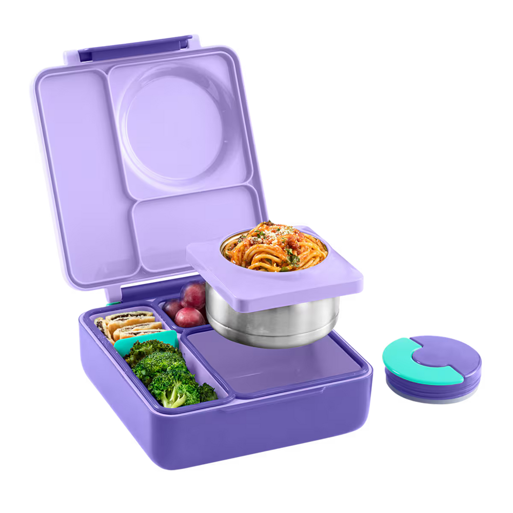 Purple bento box with compartments containing food items on a white background