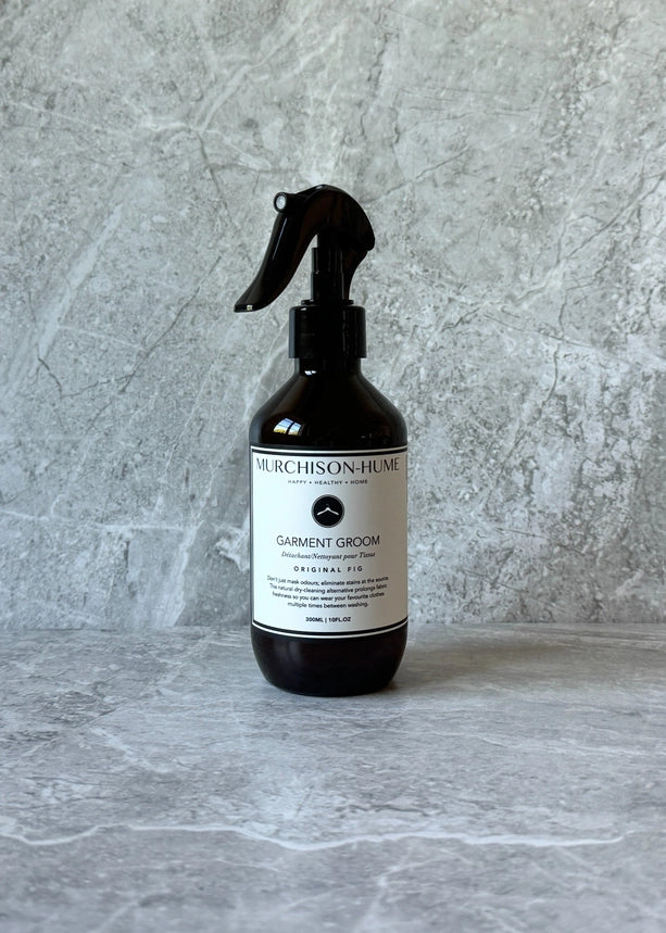 Bottle of Murchison-Hume Garment Groom on a gray textured background