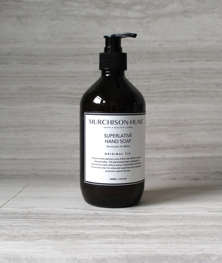Black bottle of Murchison-Hume Superlative Hand Soap on a gray surface