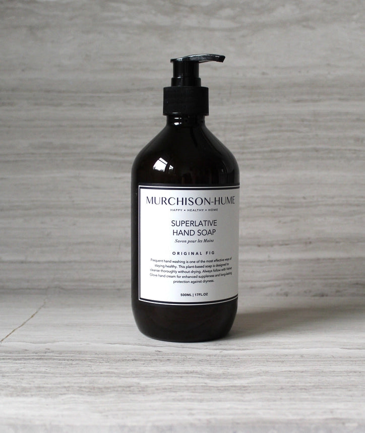 Black bottle of Murchison-Hume Superlative Hand Soap on a gray surface