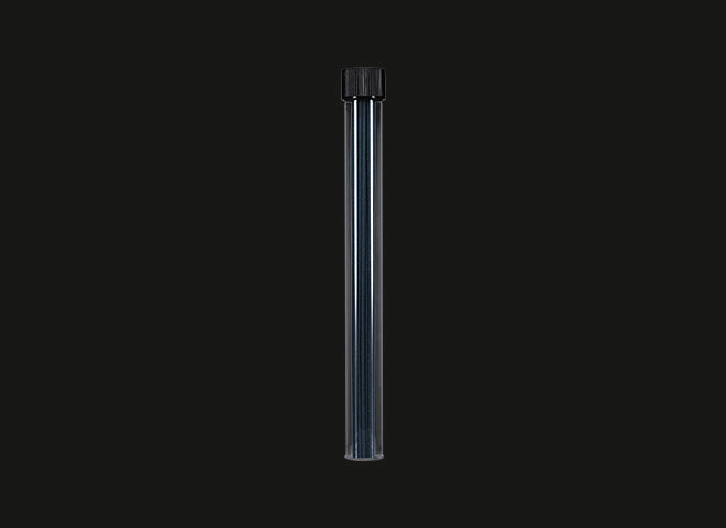 Clear plastic tube with black cap on a black background