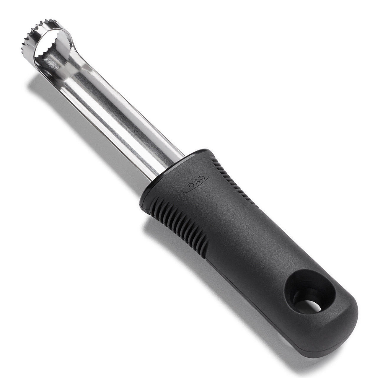 Black and silver apple corer on a white background