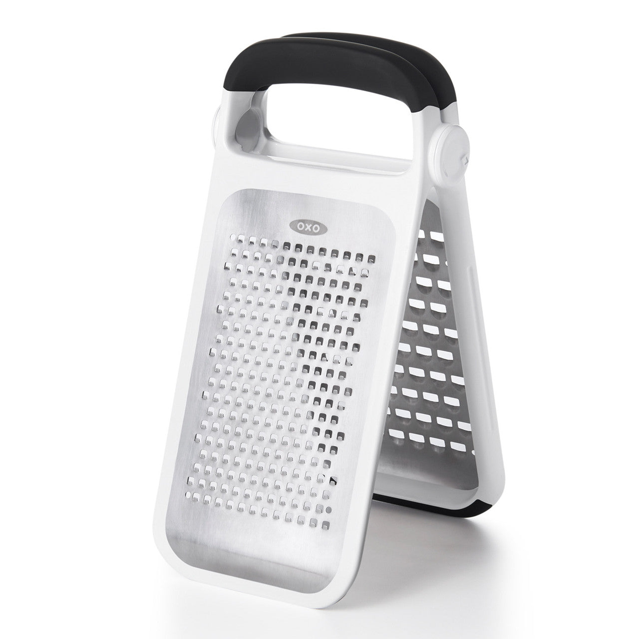 White box grater with black handle on a white background