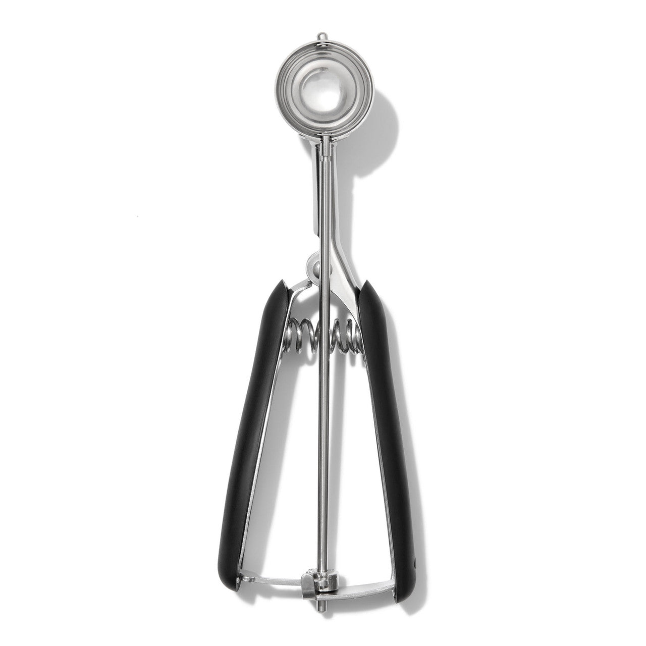 Metallic cookie scooper on a white background