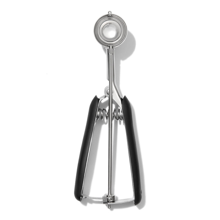Metallic cookie scooper on a white background
