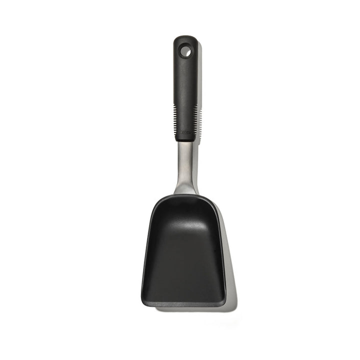 Black scoop with a textured handle on a white background