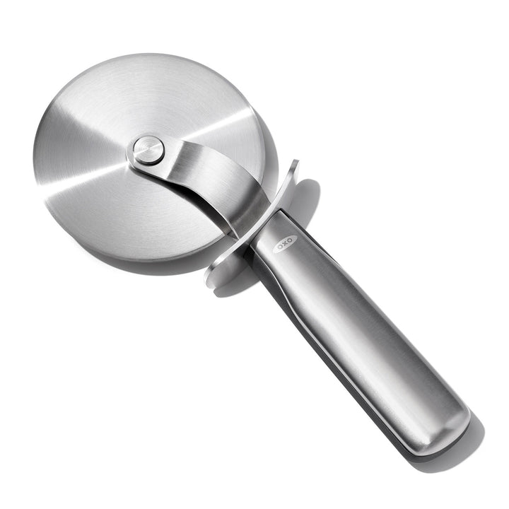 Stainless steel pizza cutter on a white background