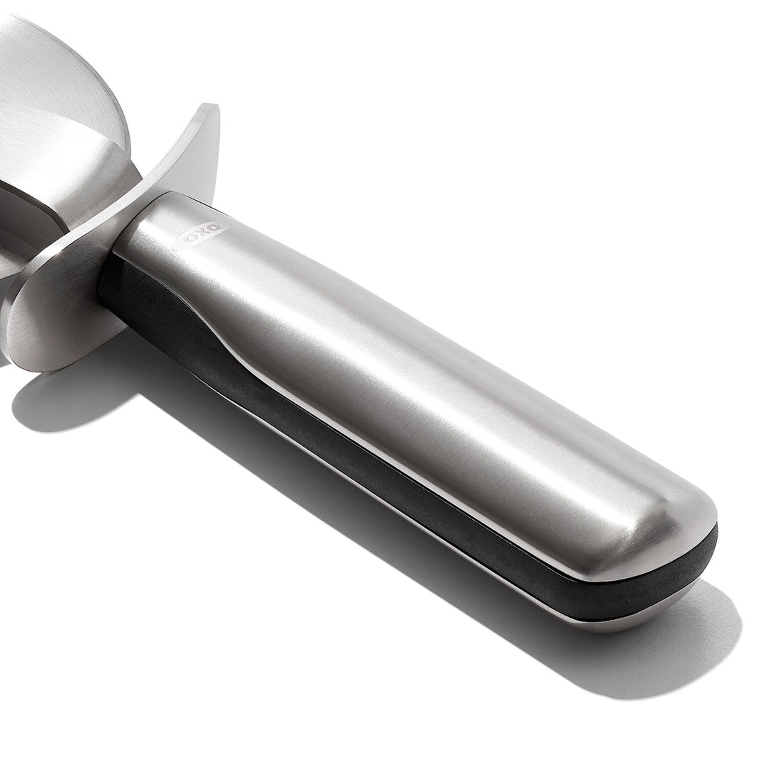 Metallic kitchen tool on a white background