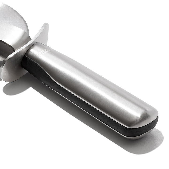 Metallic kitchen tool on a white background