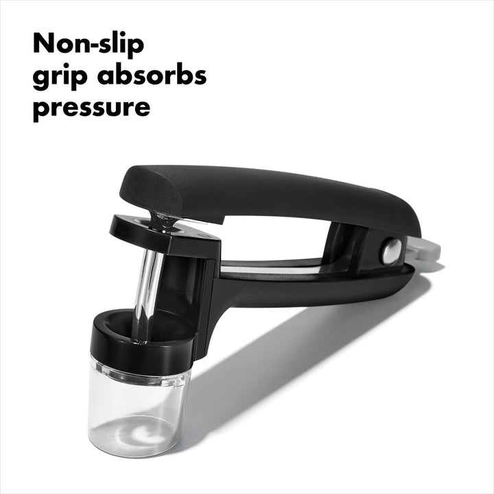 Black kitchen tool with non-slip grip and pressure absorption feature on a white background
