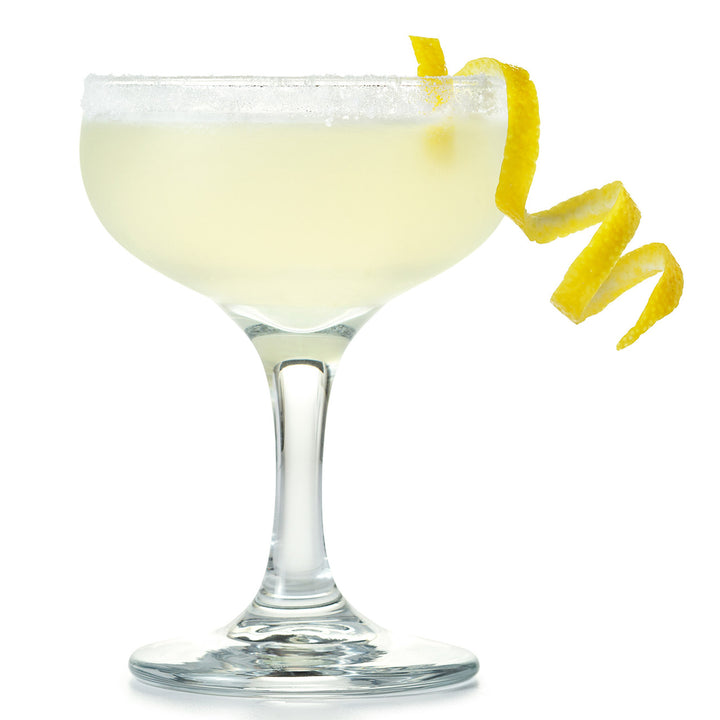 Cocktail in a glass with a lemon twist on a white background