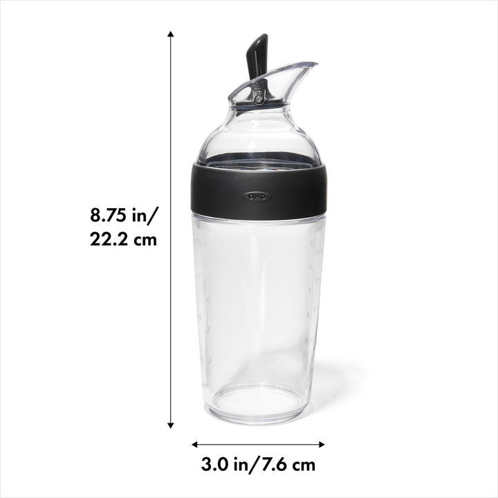 Clear carafe with black lid and measurements on a white background