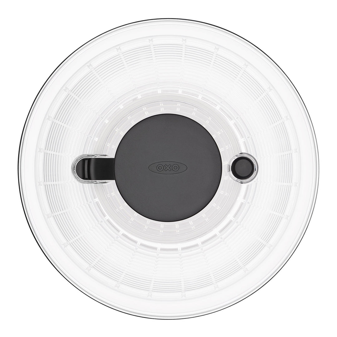 Clear lid with black handle and OXO logo on a white background