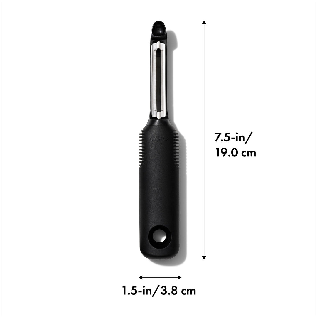 Black vegetable peeler with measurements on a white background