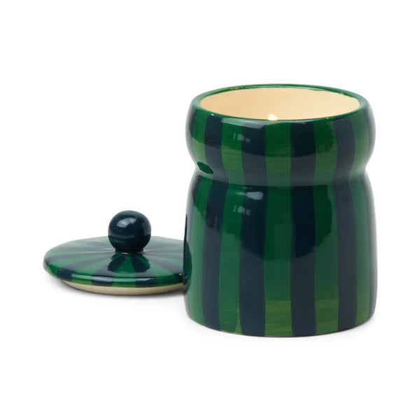 Green striped ceramic jar candle with a matching lid on a white background