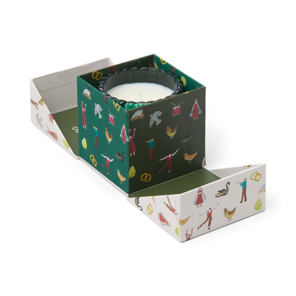 Candle in a decorative box with illustrations on a white background