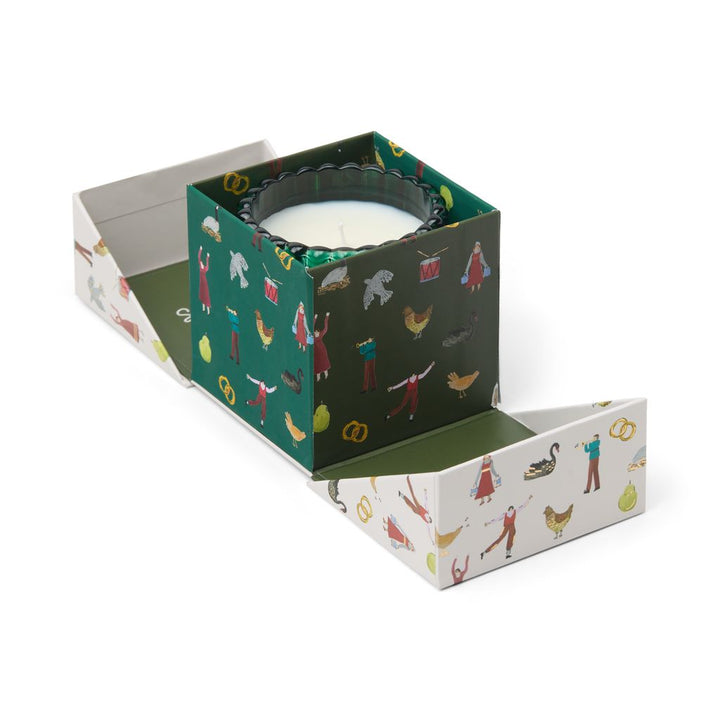 Candle in a decorative box with illustrations on a white background