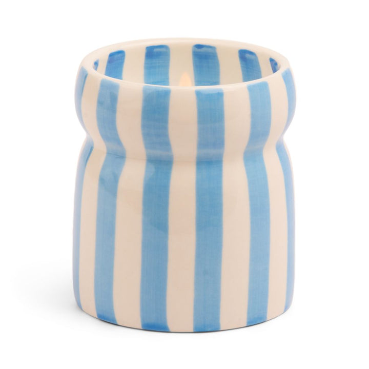 Ceramic candle holder with blue and white striped pattern on a white background