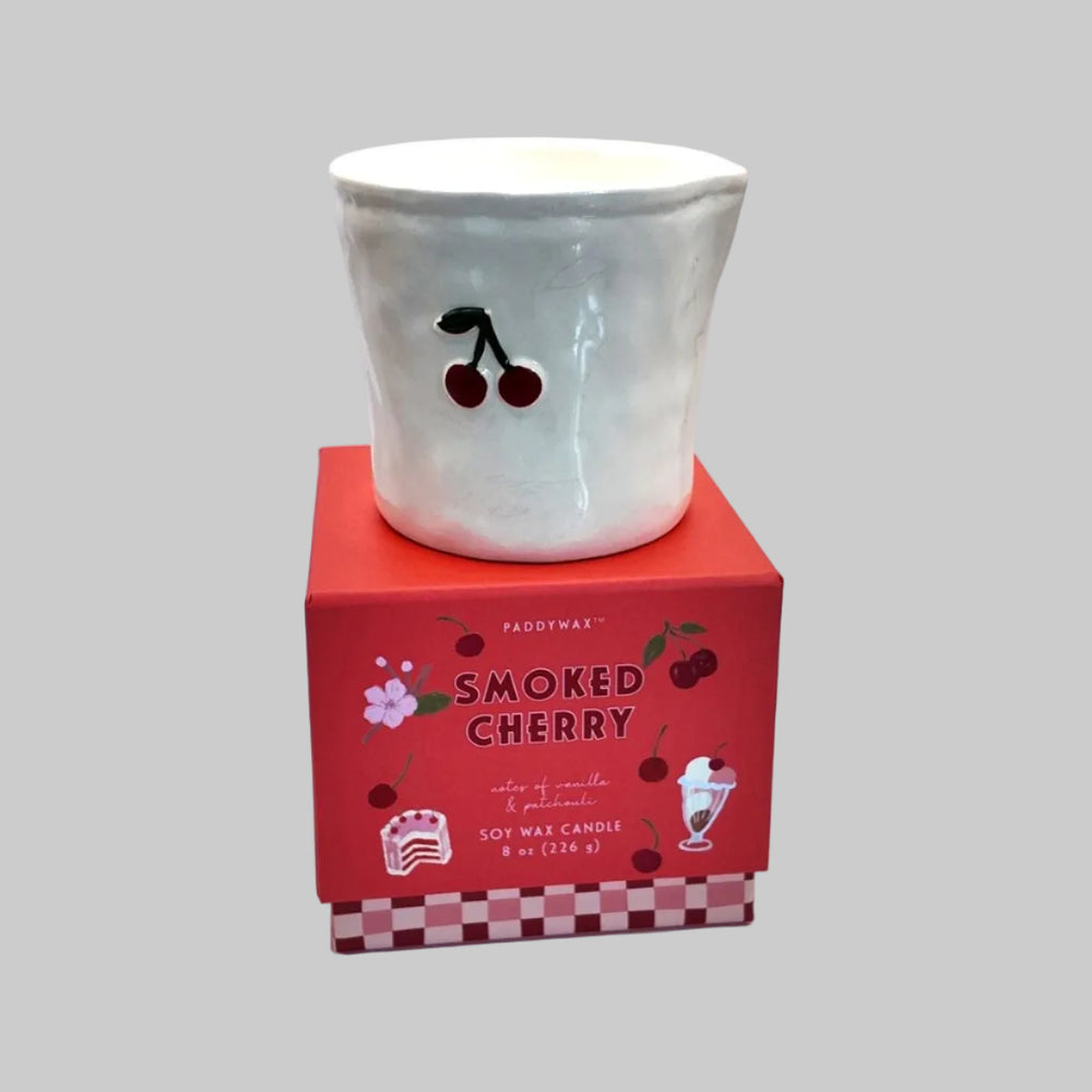 Ceramic vessel with cherry design on a red box labeled 'Smoked Cherry' against a white background