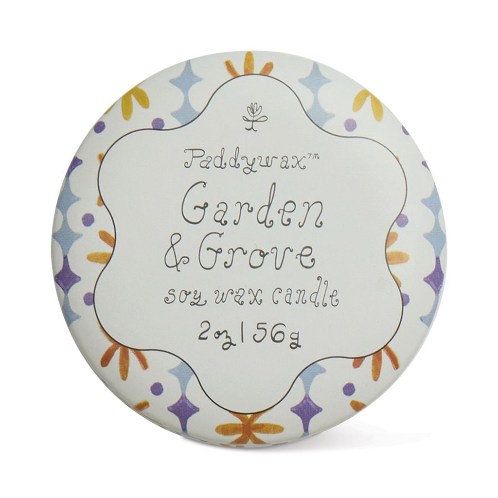 Paddywax Garden &amp; Grove candle packaging with decorative border on a white background