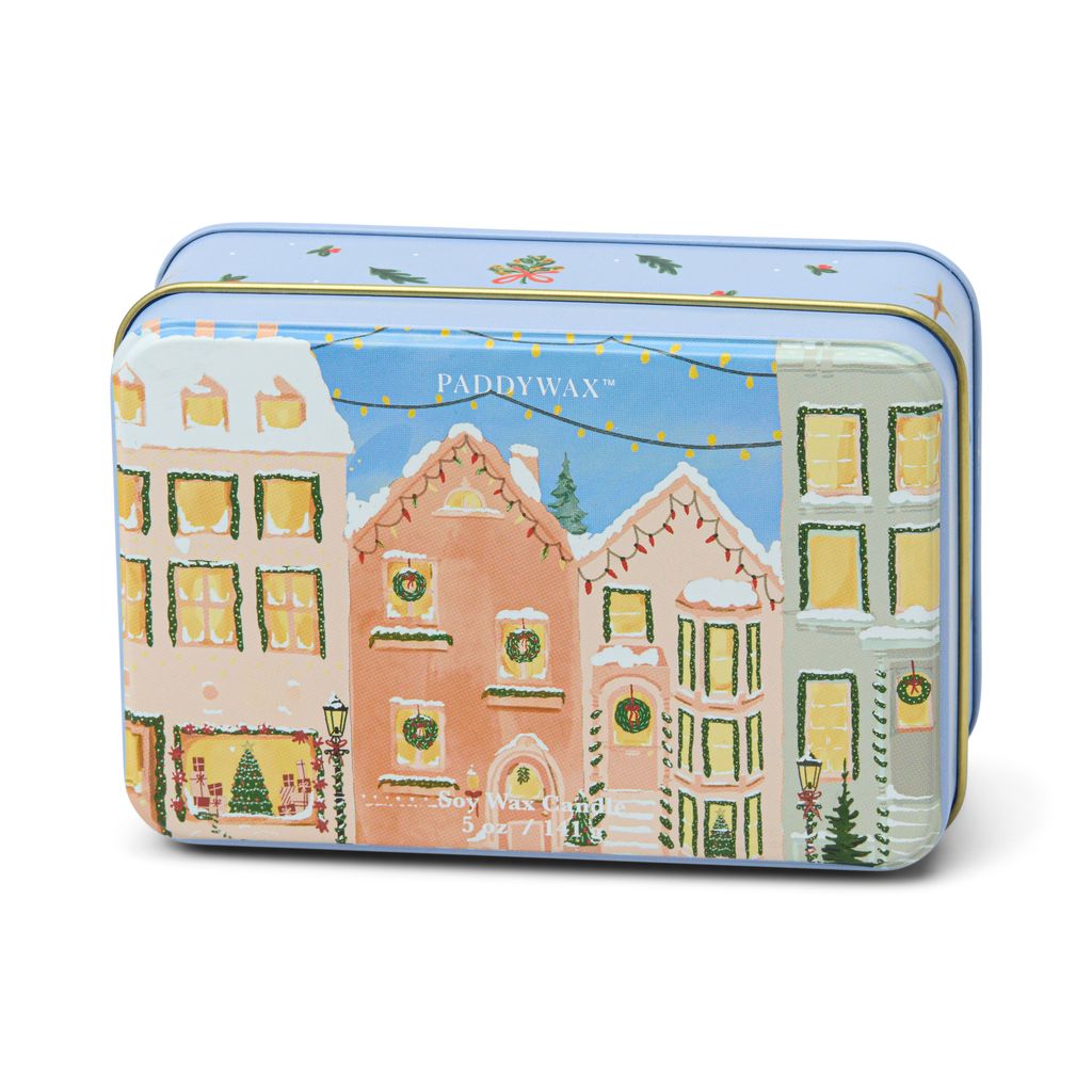 Tin packaging with festive village design and PaddyWax branding on a white background