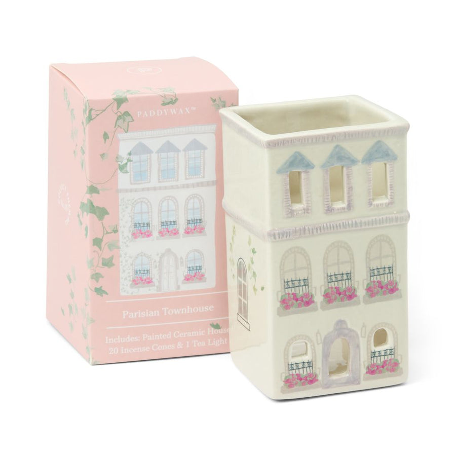 Decorative wax warmer with Parisian Townhouse design next to its packaging on a white background