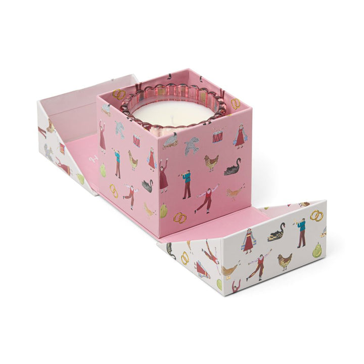 Glass pink candle in decorative in decorative gift box with Christmas theme