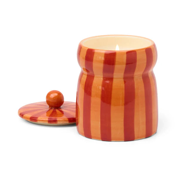 Ceramic jar candle with striped pattern on a white background