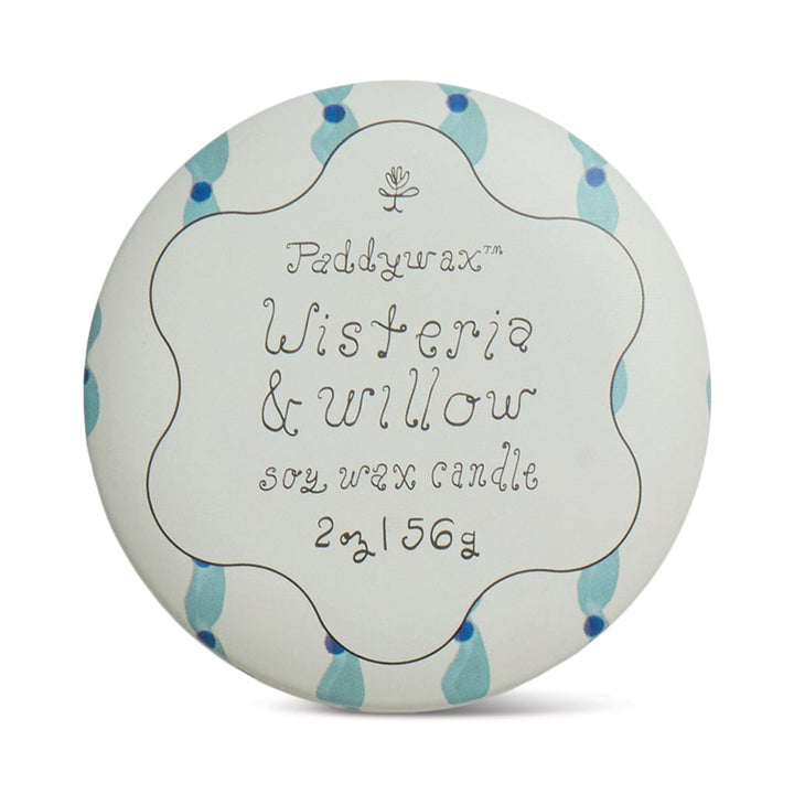 Paddywax Wisteria &amp; Willow candle packaging with blue accents on a white background