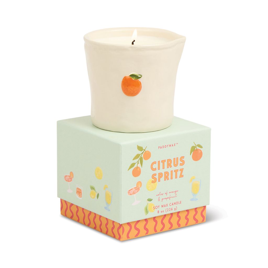 Candle in a decorative box labeled 'Citrus Spritz' on a white background
