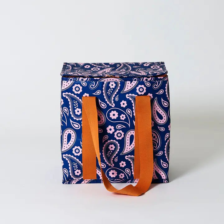 Blue patterned bag with orange handles on a white background