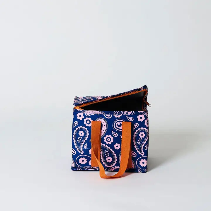 Blue patterned bag with orange straps on a white background