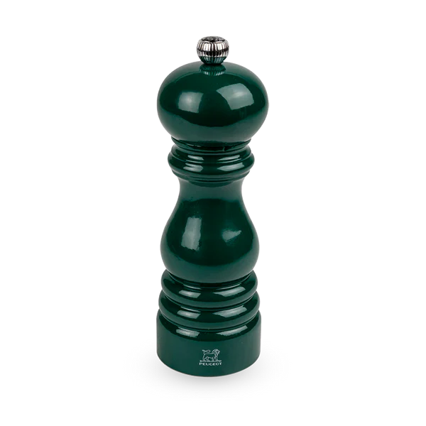 Green pepper grinder on a white background