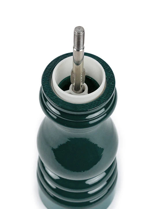 Green salt mill on a white background