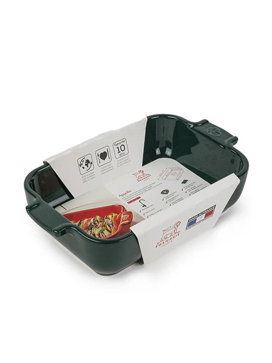 Green ceramic baker with printed instructions on a white background