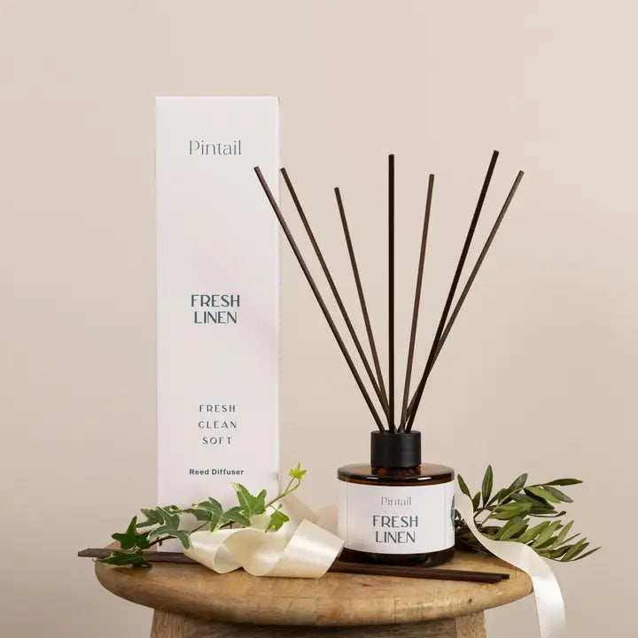 Pintail Fresh Linen diffuser with packaging on a wooden stand