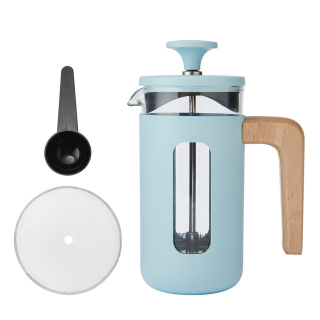 Light blue French press coffee maker with wooden handle and accessories on a white background