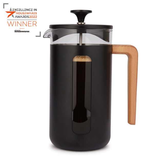 Black French press coffee maker with wooden handle on a white background, featuring an award badge.