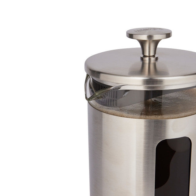 Stainless steel coffee press on a white background