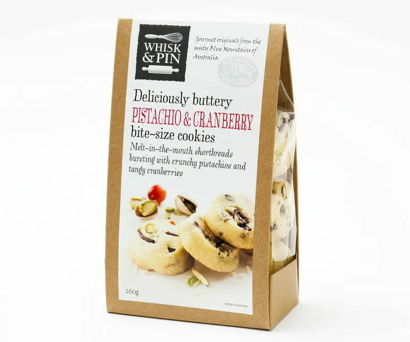 Package of Whisk & Pin pistachio and cranberry cookies on a white background